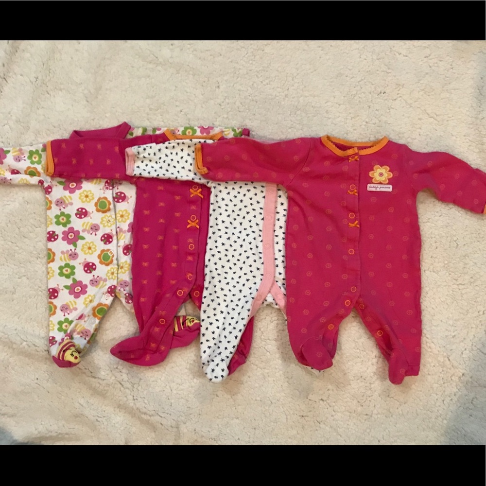 Lot of 4 Carter’s Newborn Snap closure pajamas.